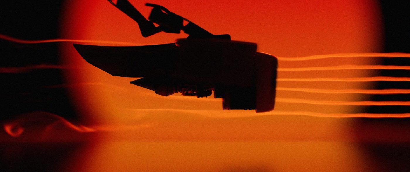Engine silhouette against an orange sun