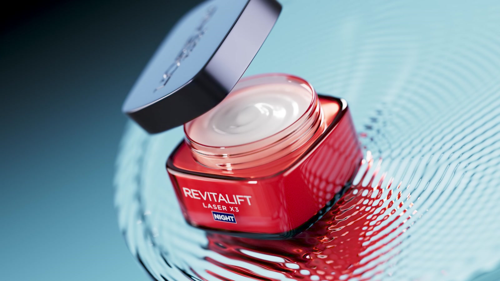 L'Oréal Revitalift jar on red liquid